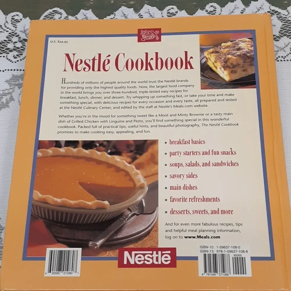 3-pc. Nestle's chocolate bundle: 2‎ vintage tins and a hardcover cookbook